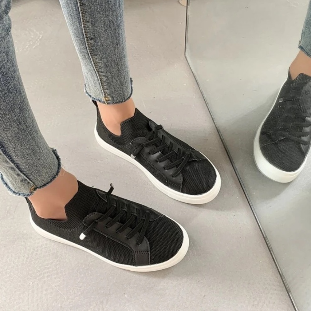 Brand new worn once little black sneakers with tie or non-tie laces!